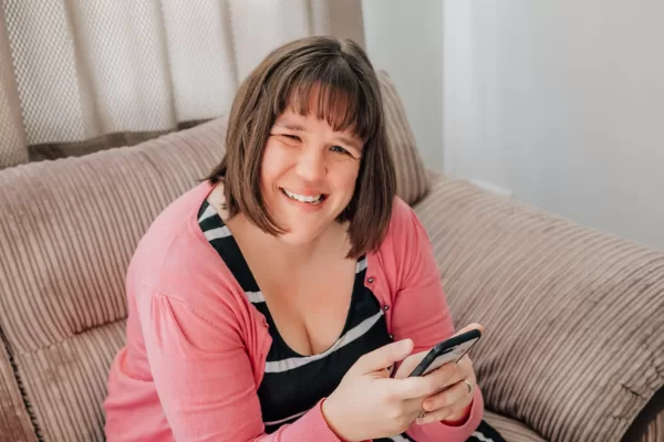 Steph looking up from reading phone